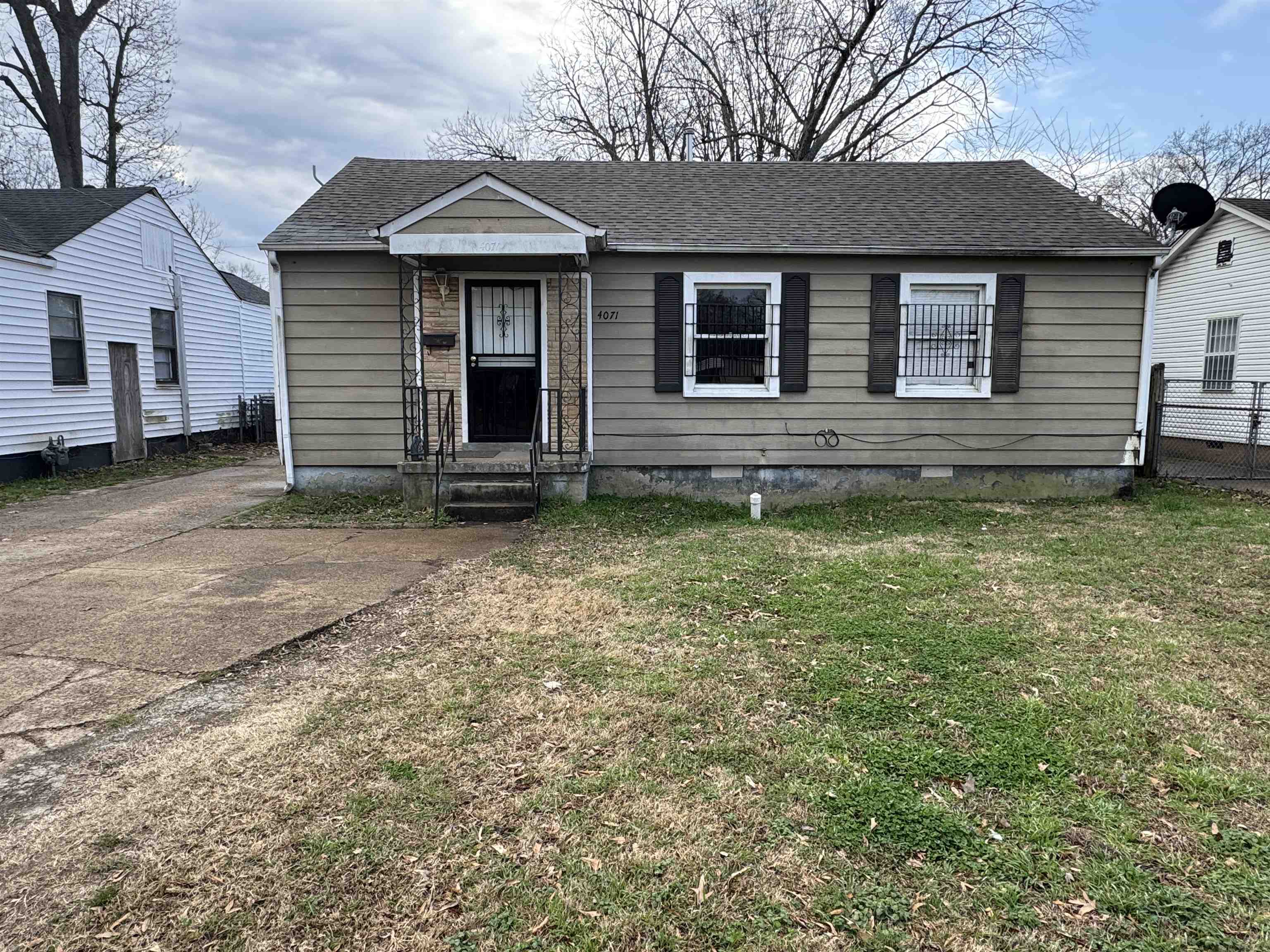 4071 Grey Road Memphis, TN 38108 - Photo 1 of 8 Bungalow with a shingled roof, crawl space, and a front lawn