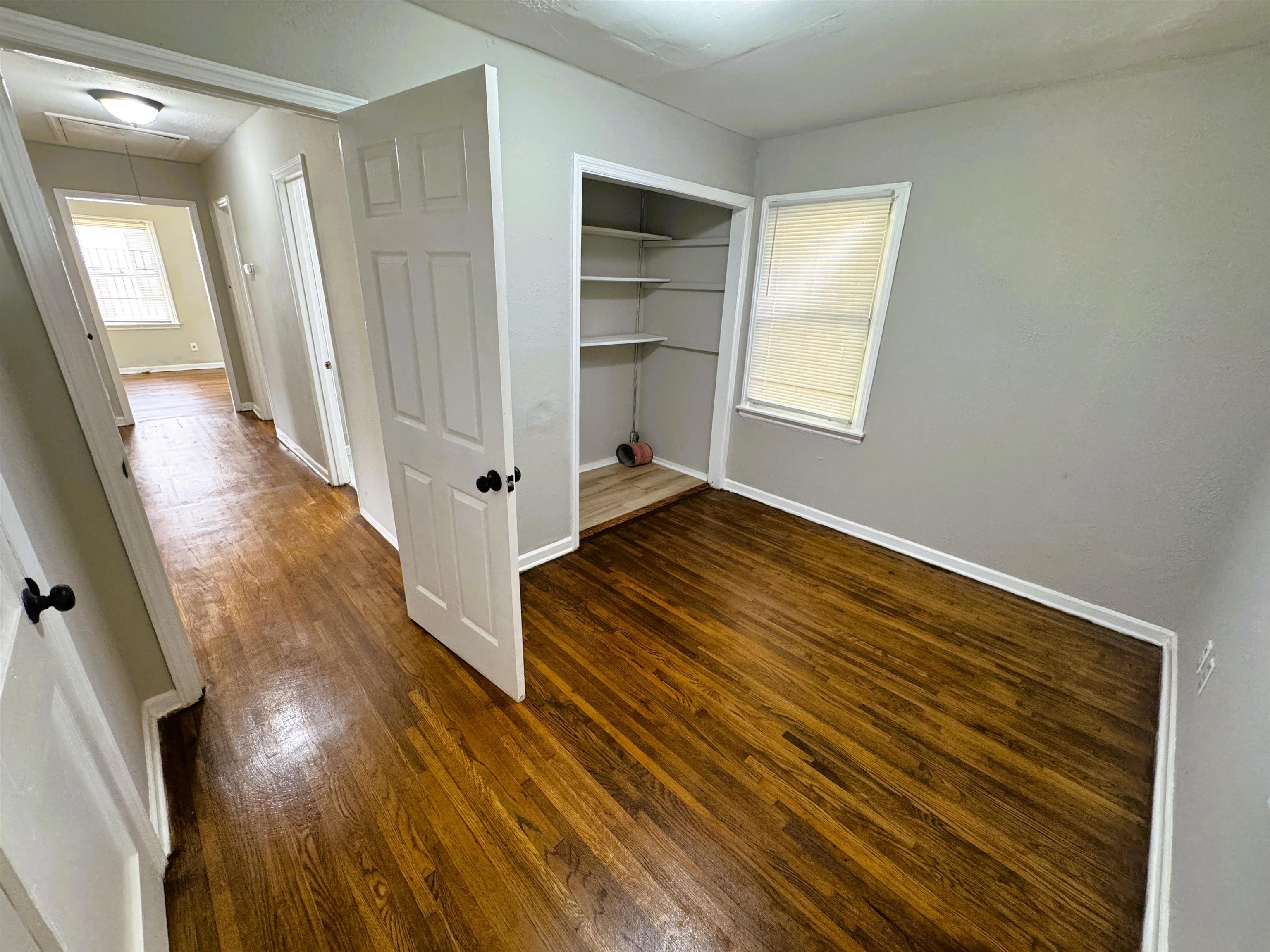 4071 Grey Road Memphis, TN 38108 - Photo 11 of 15 wooden floor in an empty room with a window