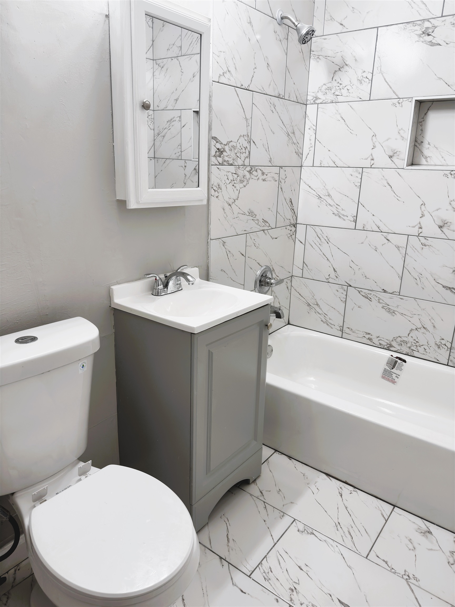 4071 Grey Road Memphis, TN 38108 - Photo 12 of 15 a bathroom with a sink a toilet and mirror