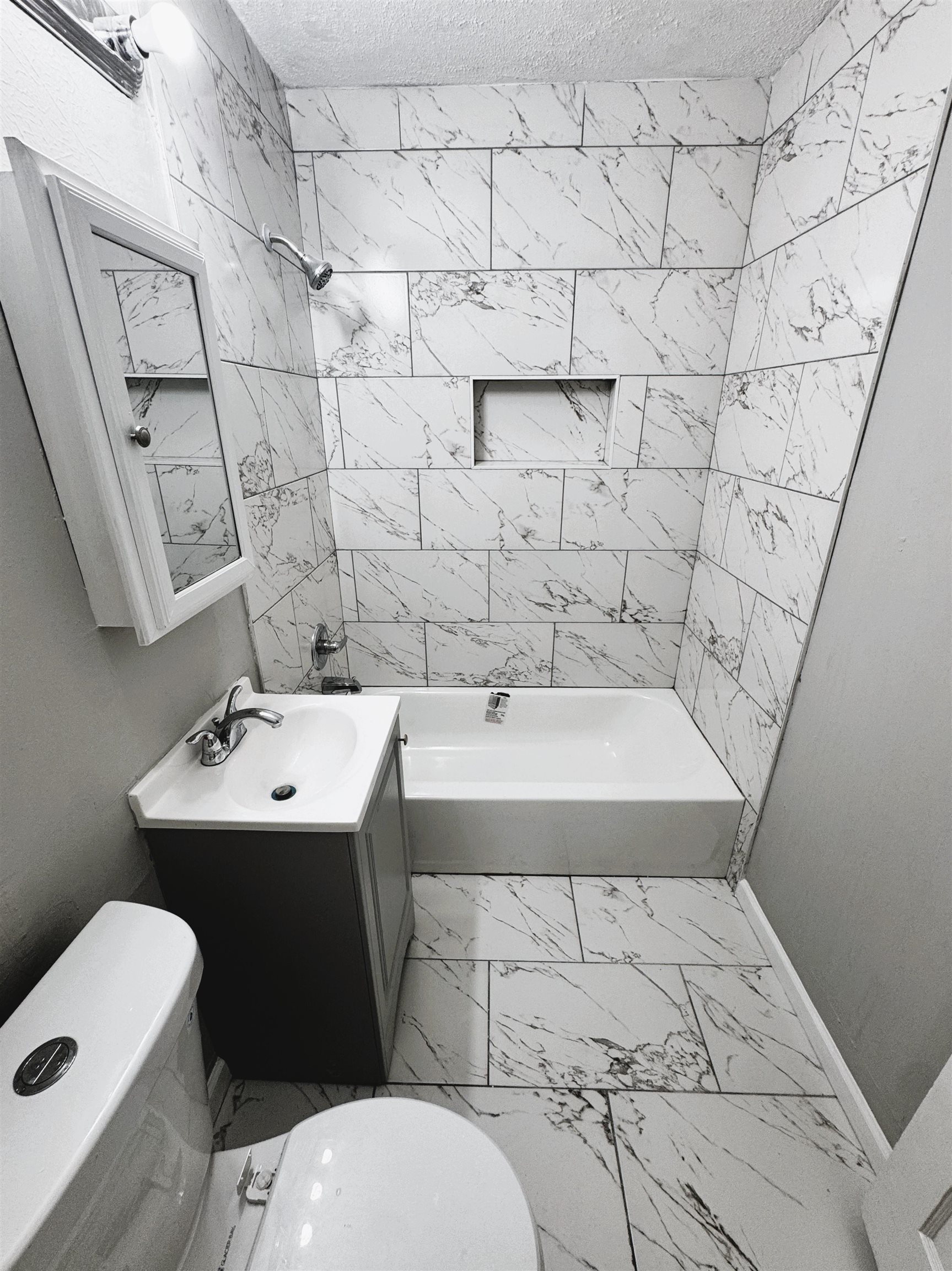 4071 Grey Road Memphis, TN 38108 - Photo 13 of 15 a bathroom with a sink toilet and shower
