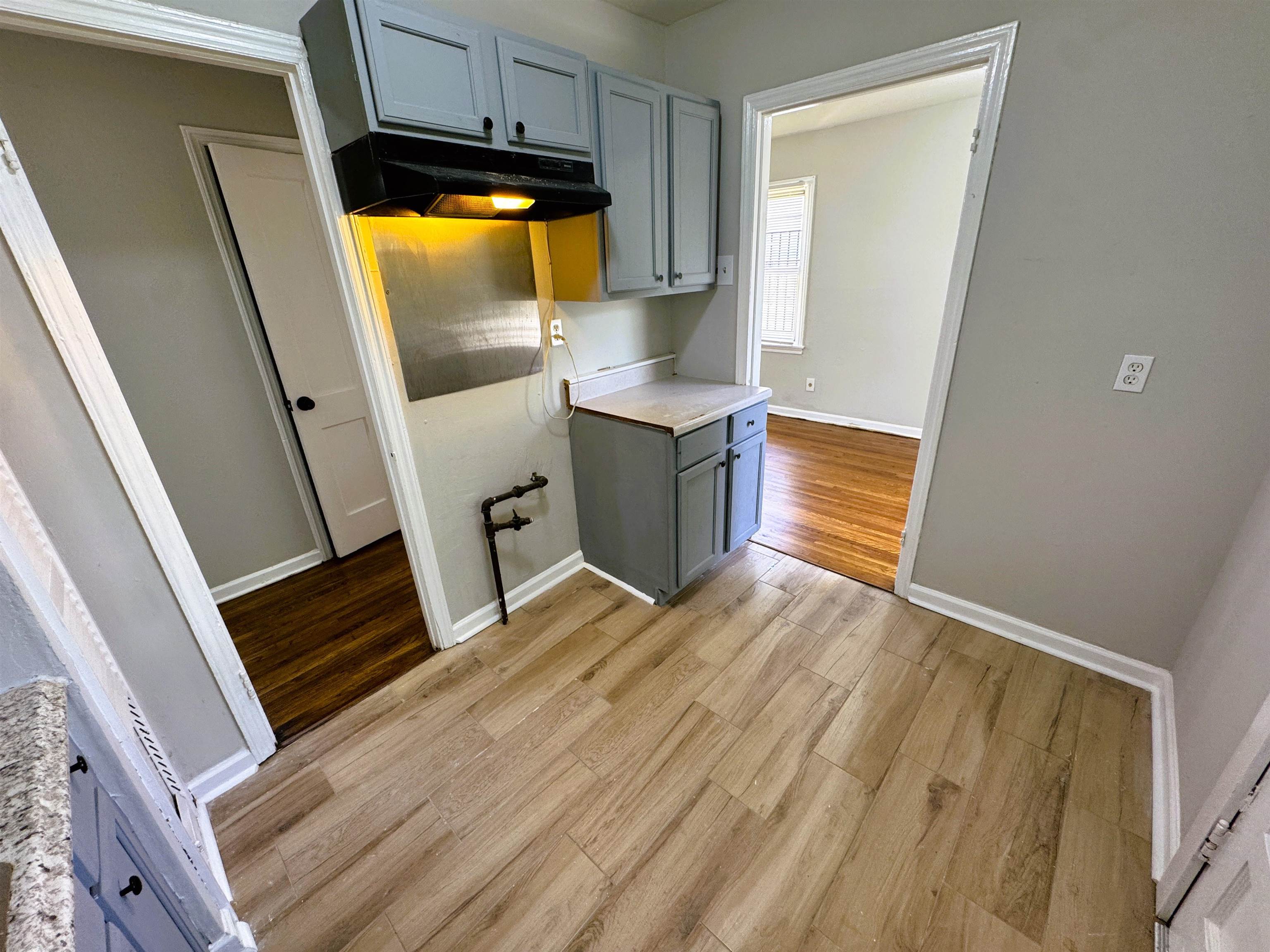 4071 Grey Road Memphis, TN 38108 - Photo 6 of 15 a view of kitchen and wooden floor