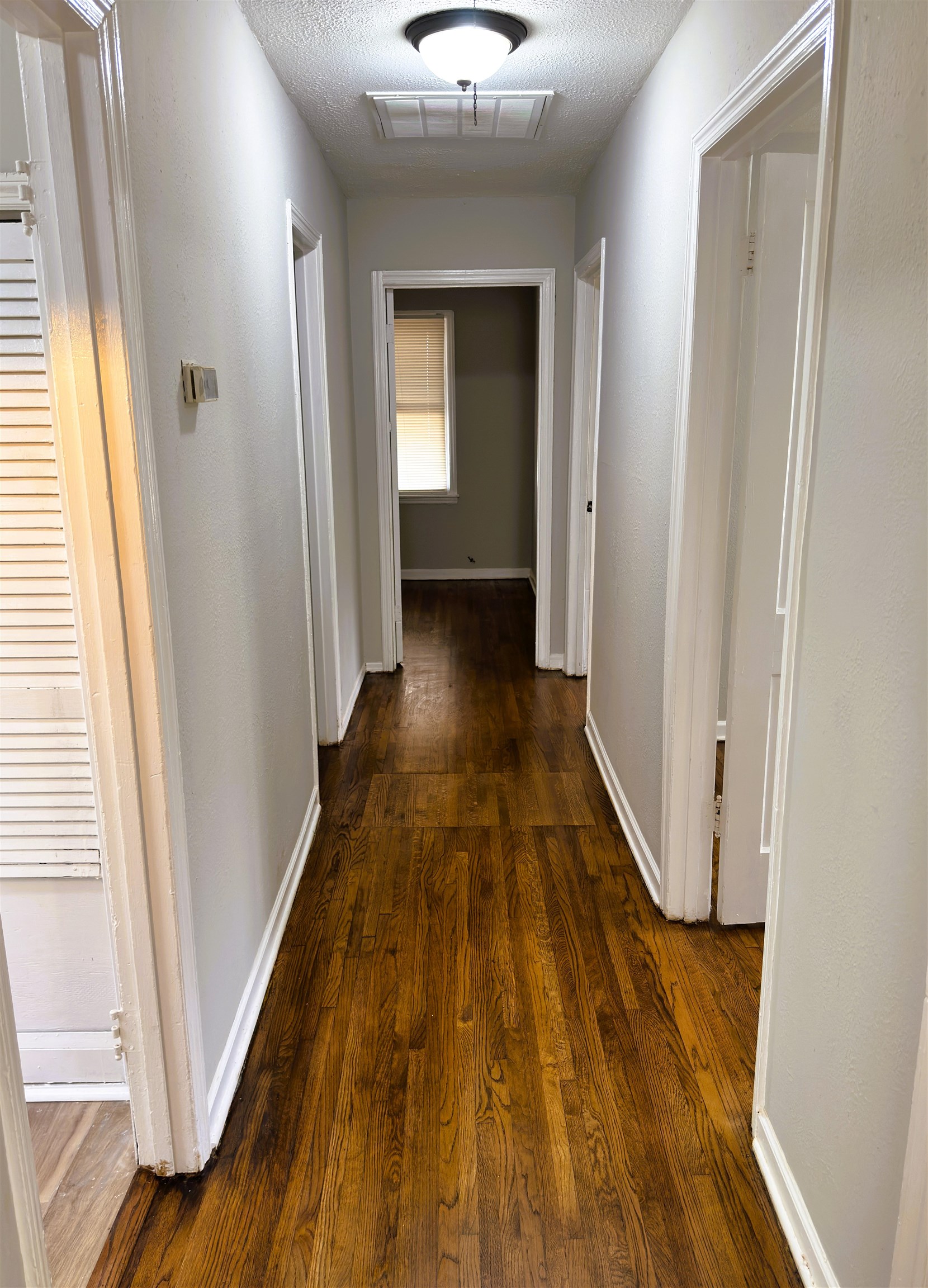 4071 Grey Road Memphis, TN 38108 - Photo 8 of 15 a view of a hallway view with wooden floor and staircase