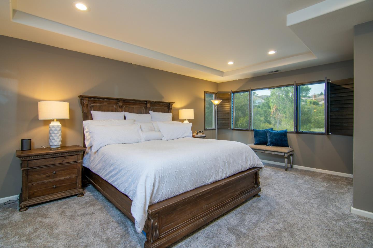 5871 Killarney Circle San Jose, CA 95138 - Photo 19 of 33 a bedroom with a bed and large windows