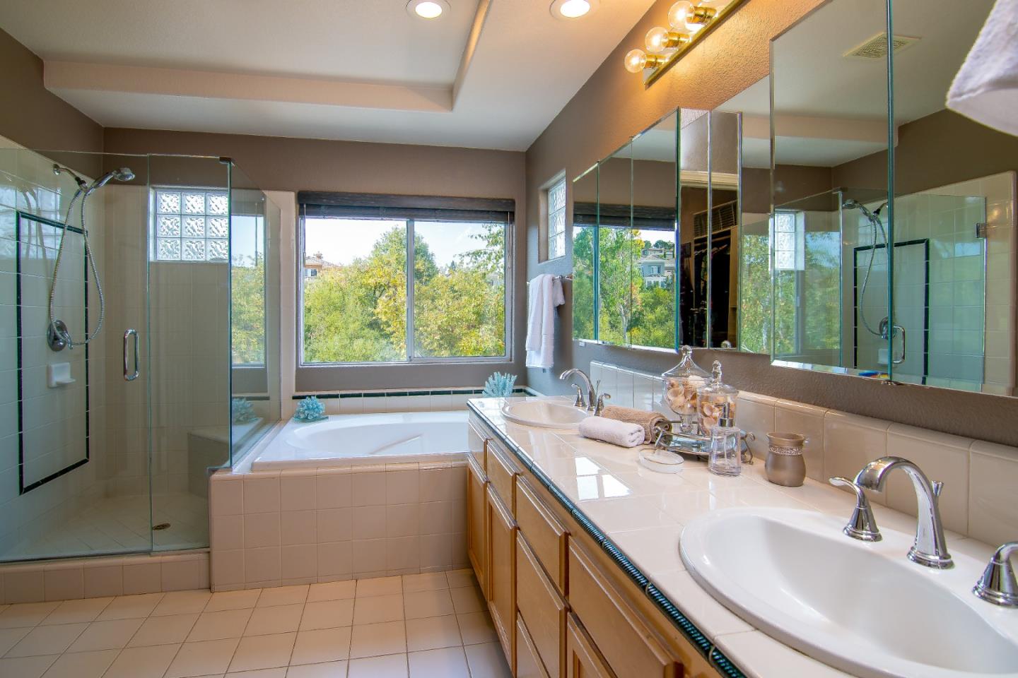 5871 Killarney Circle San Jose, CA 95138 - Photo 21 of 33 a bathroom with a tub sink and mirror
