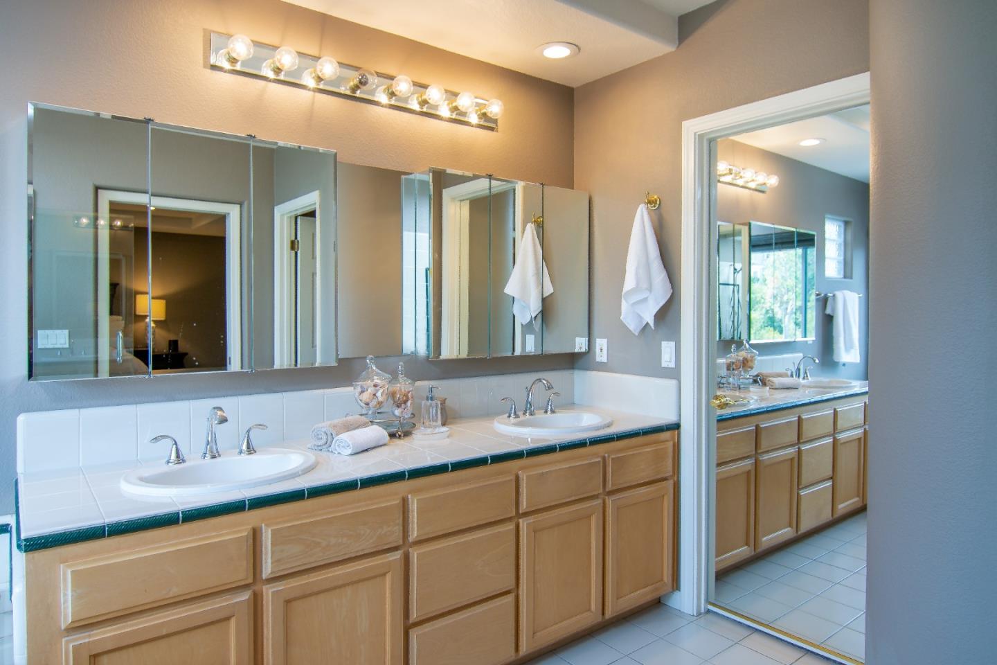 5871 Killarney Circle San Jose, CA 95138 - Photo 23 of 33 a bathroom with double vanity and a mirror
