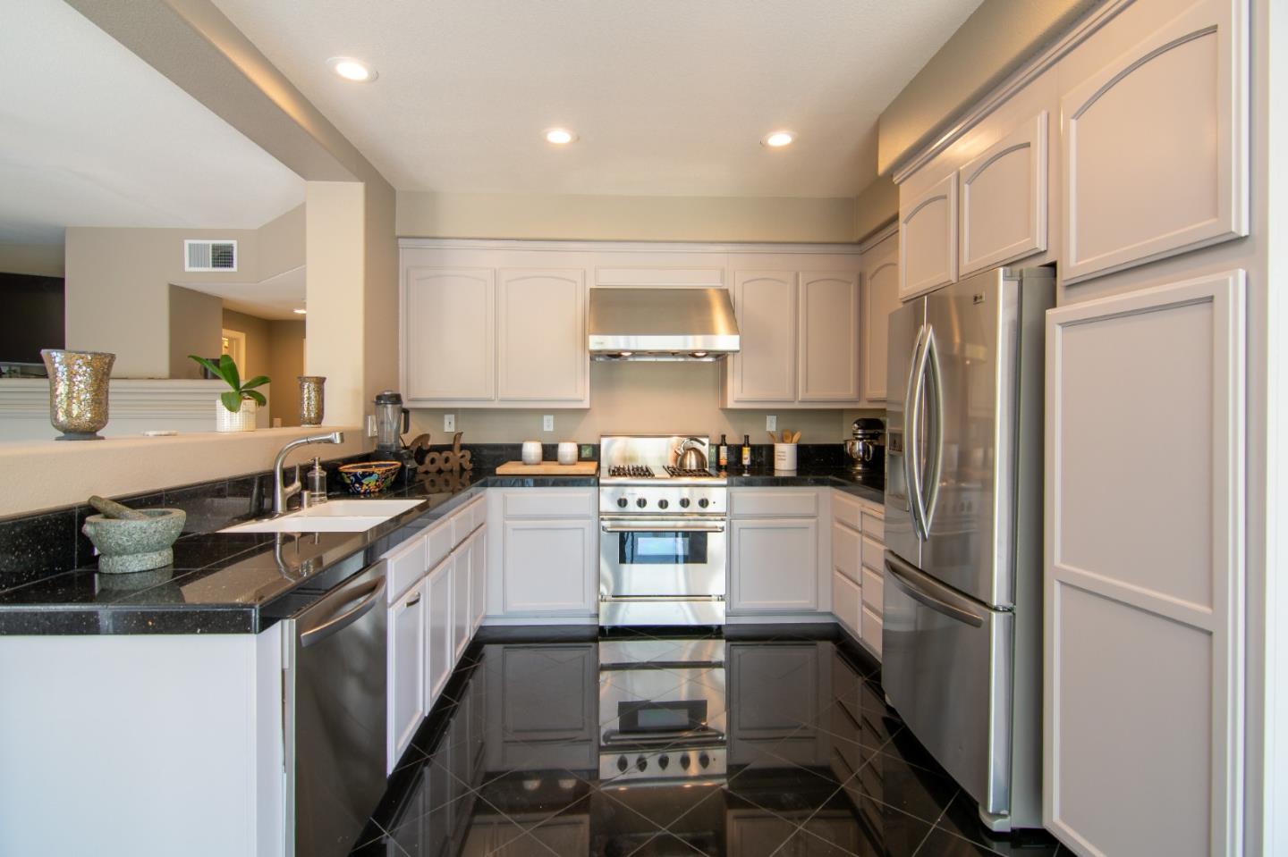 5871 Killarney Circle San Jose, CA 95138 - Photo 10 of 33 a kitchen with a refrigerator and a sink