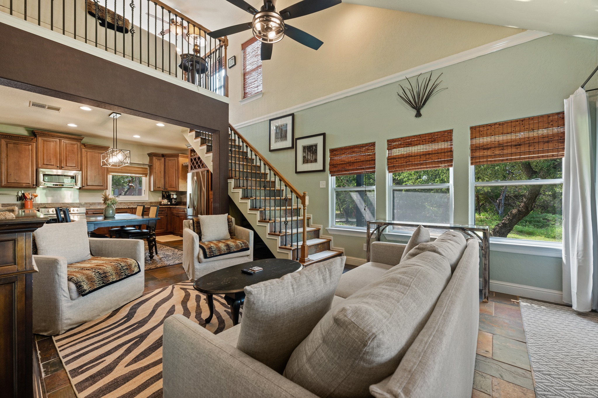 12932 Nutty Brown Road Austin, TX 78737 - Photo 6 of 40 The Manor - Spacious living room filled with natural light and warm, inviting finishes.