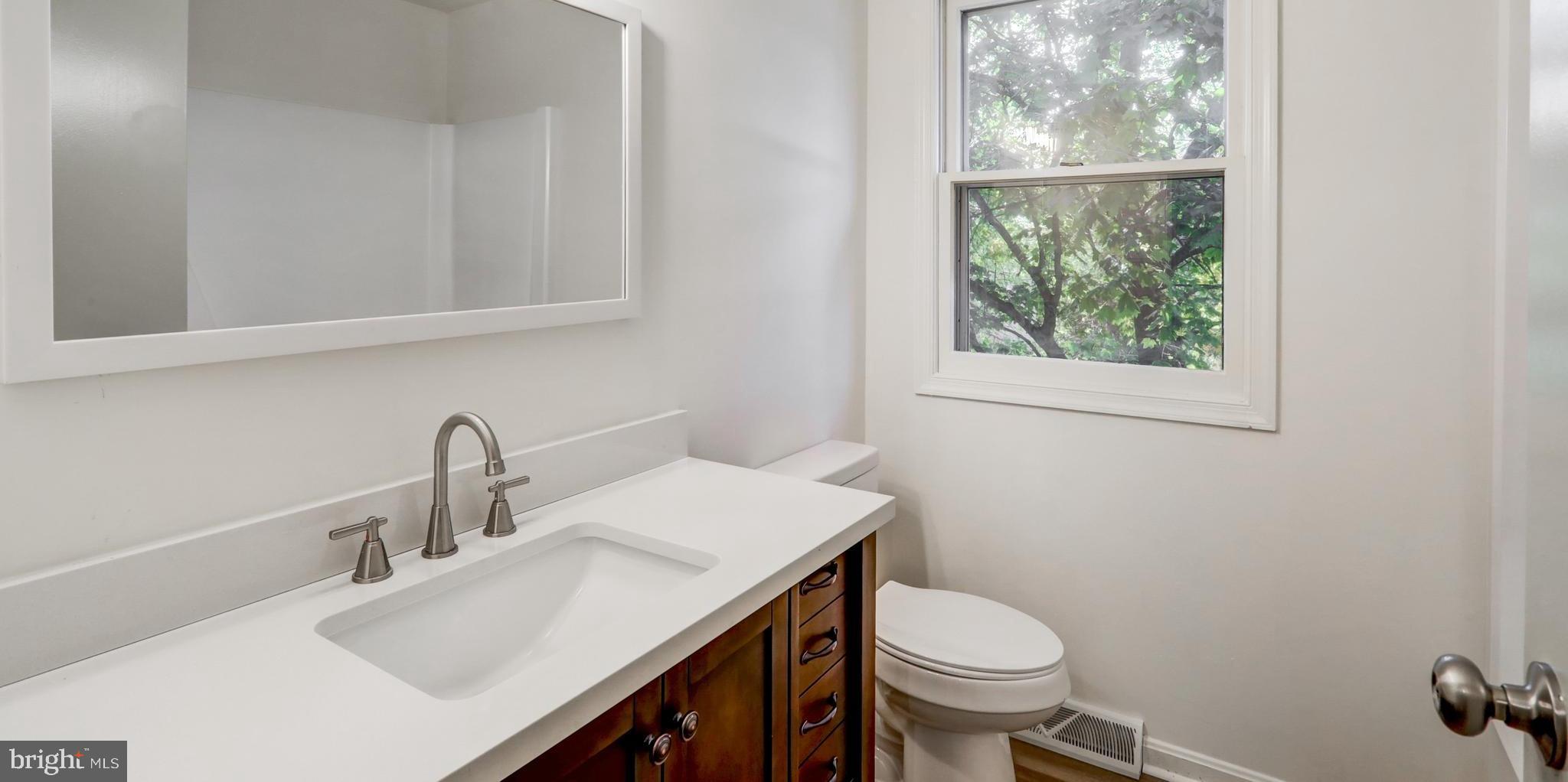 460 Longmeadow Road Lancaster, PA 17601 - Photo 21 of 43 a bathroom with a sink toilet and a window