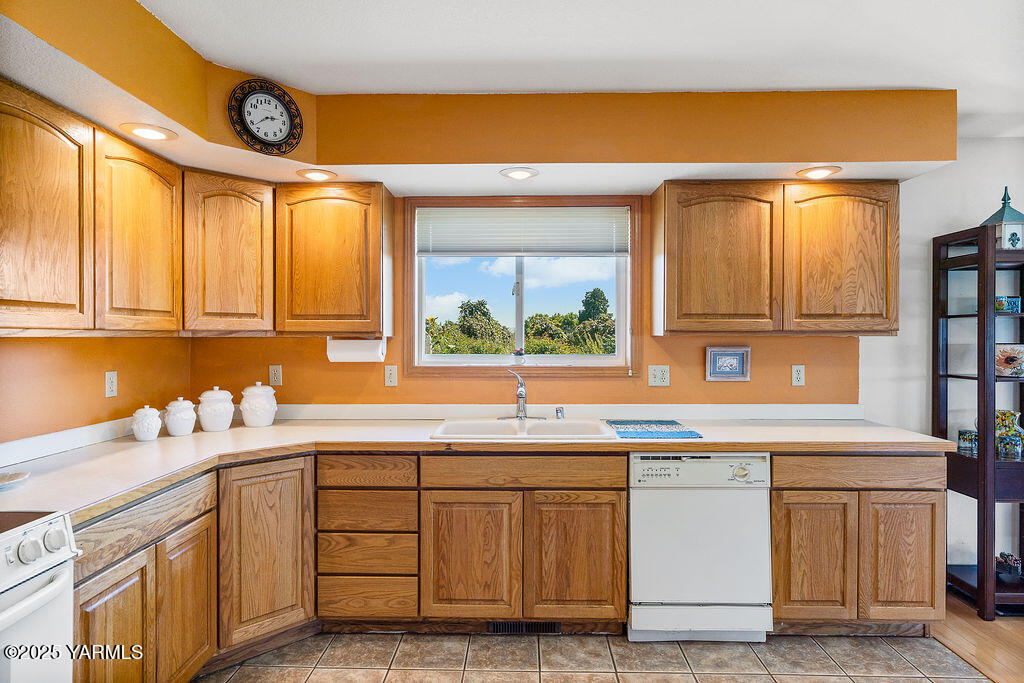 360 Orchardvale Road Zillah, WA 98953 - Photo 14 of 31 a kitchen with a sink and cabinets