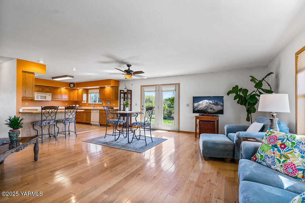 360 Orchardvale Road Zillah, WA 98953 - Photo 7 of 31 a living room with furniture and wooden floor