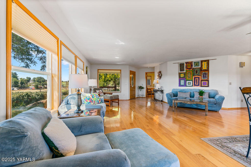 360 Orchardvale Road Zillah, WA 98953 - Photo 8 of 31 a living room with furniture and a large window