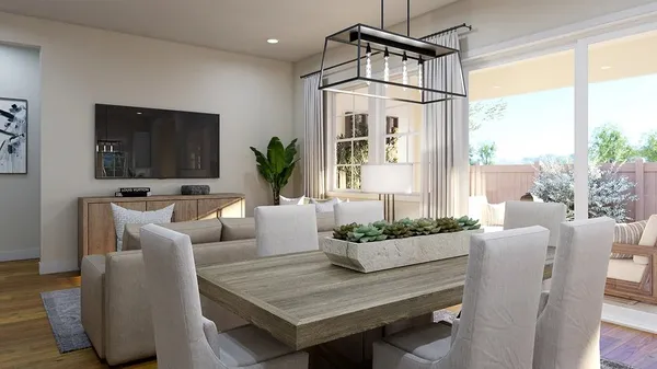 a living room with furniture a flat screen tv and a large window