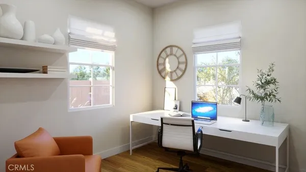 a room with furniture a window and a clock