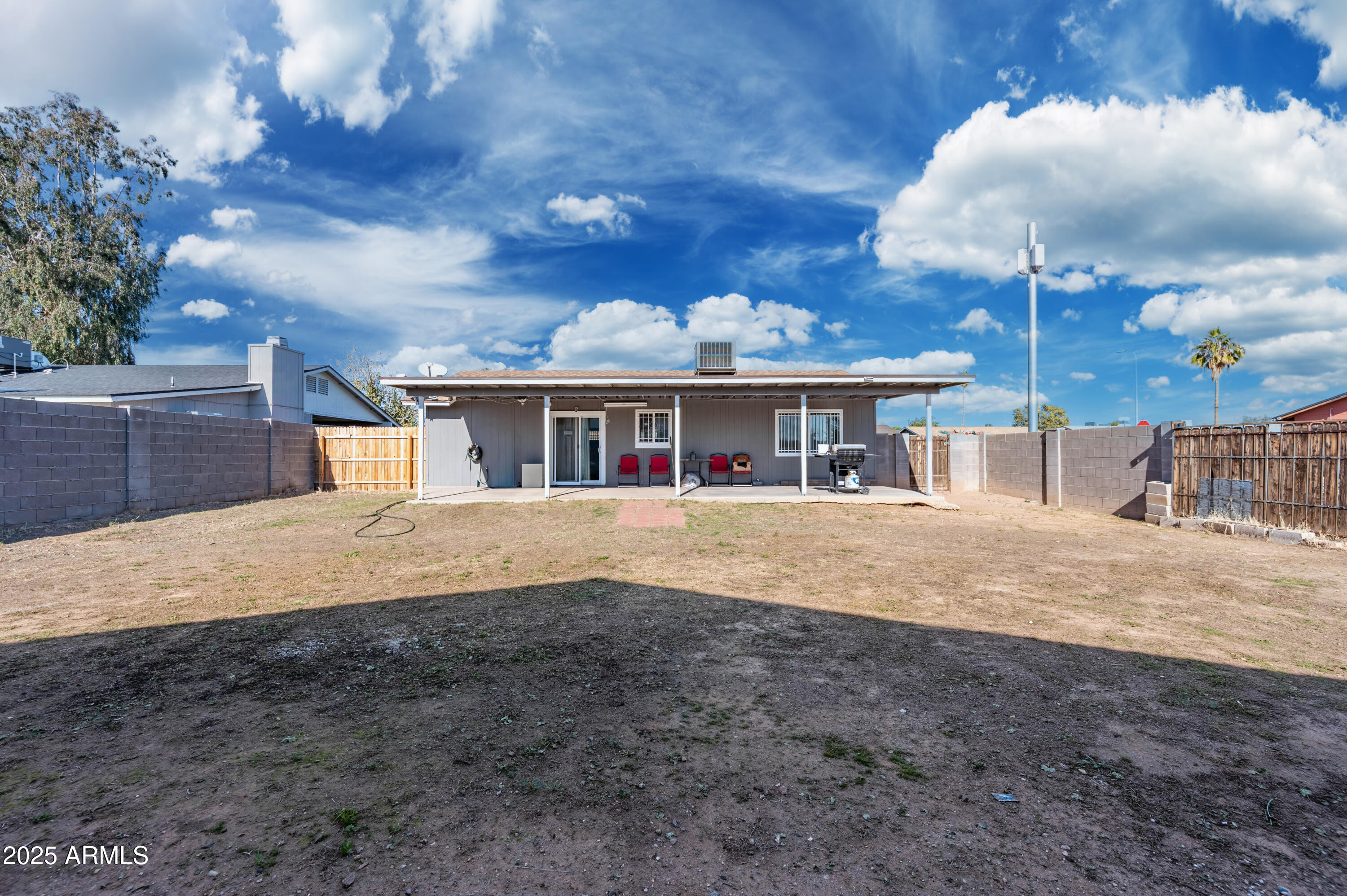 7231 West Flower Street Phoenix, AZ 85033 - Photo 15 of 17 a view of house with a yard