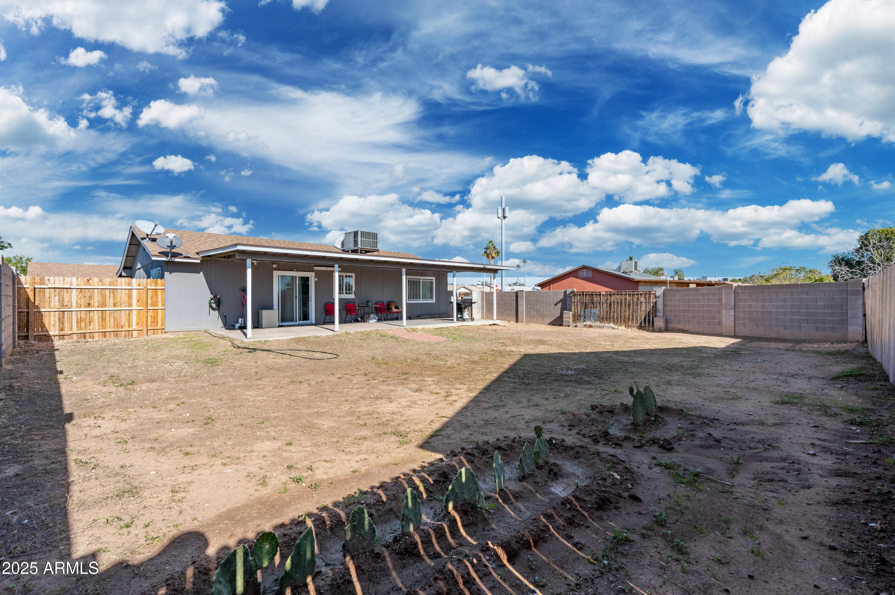 7231 West Flower Street Phoenix, AZ 85033 - Photo 16 of 17 a view of a house with a patio