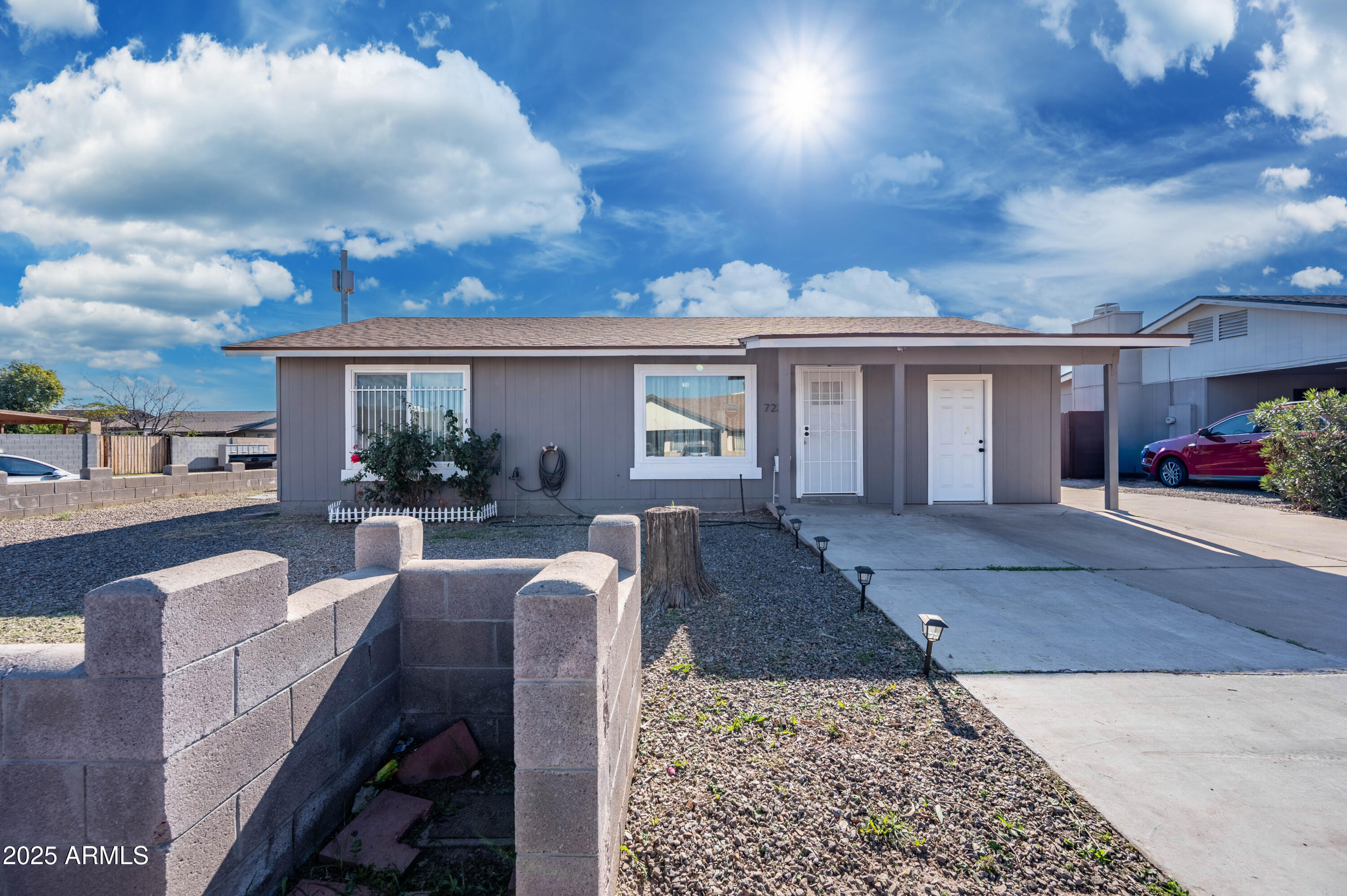 7231 West Flower Street Phoenix, AZ 85033 - Photo 2 of 17 a view of a house with backyard and sitting area
