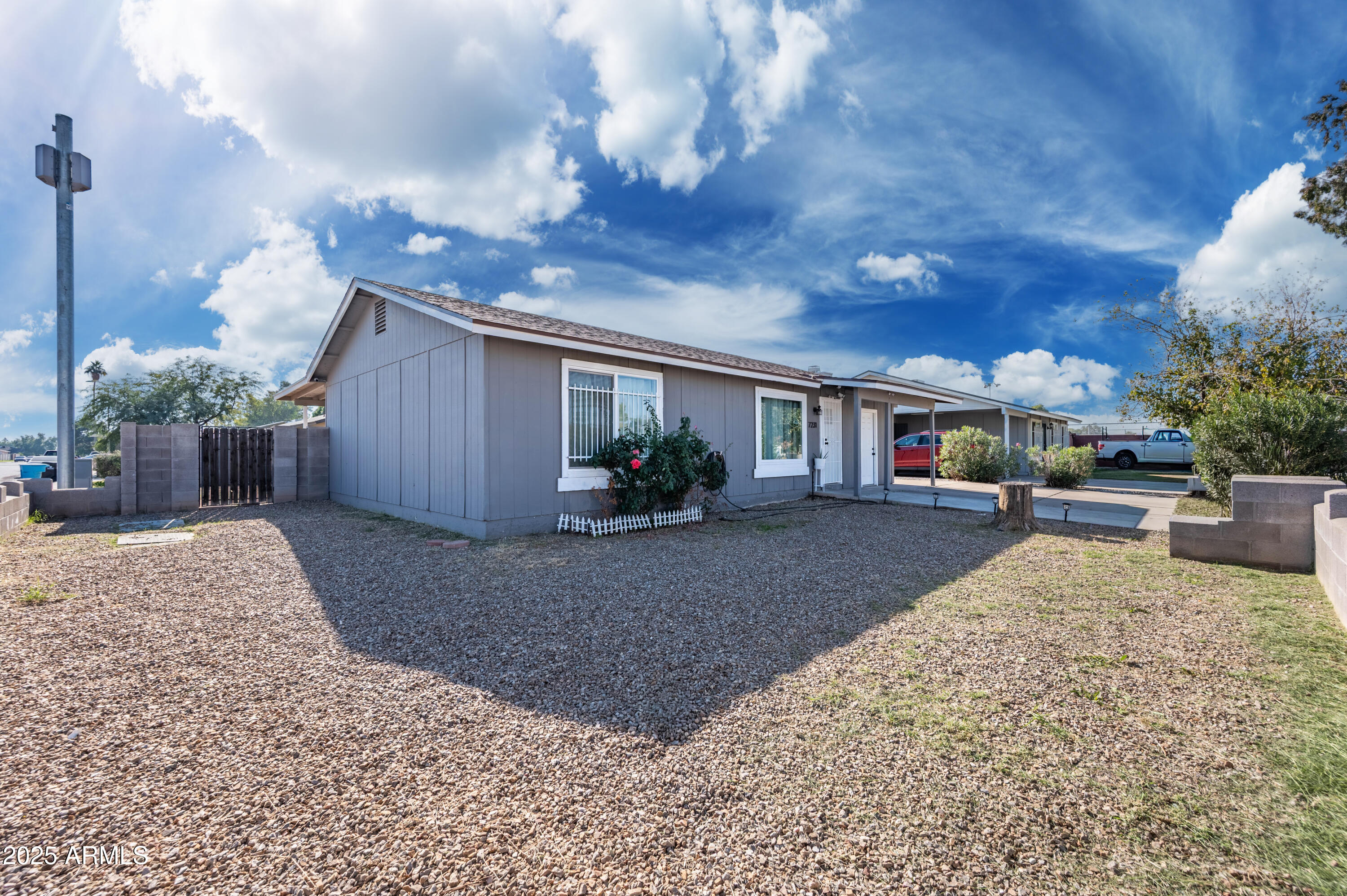 7231 West Flower Street Phoenix, AZ 85033 - Photo 3 of 17 a view of a house with backyard and sitting area