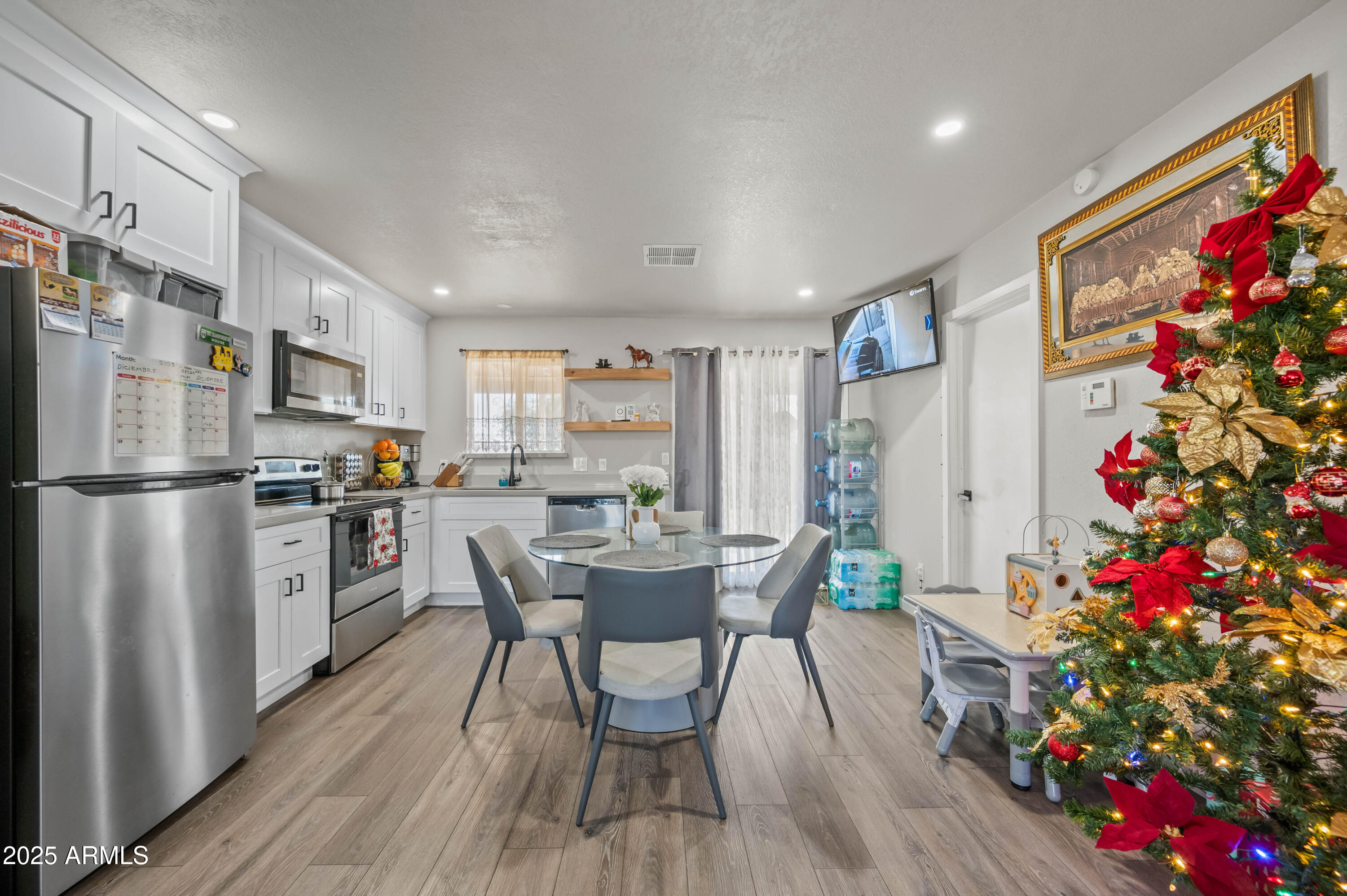 7231 West Flower Street Phoenix, AZ 85033 - Photo 5 of 17 a view of a dining room with furniture window and wooden floor
