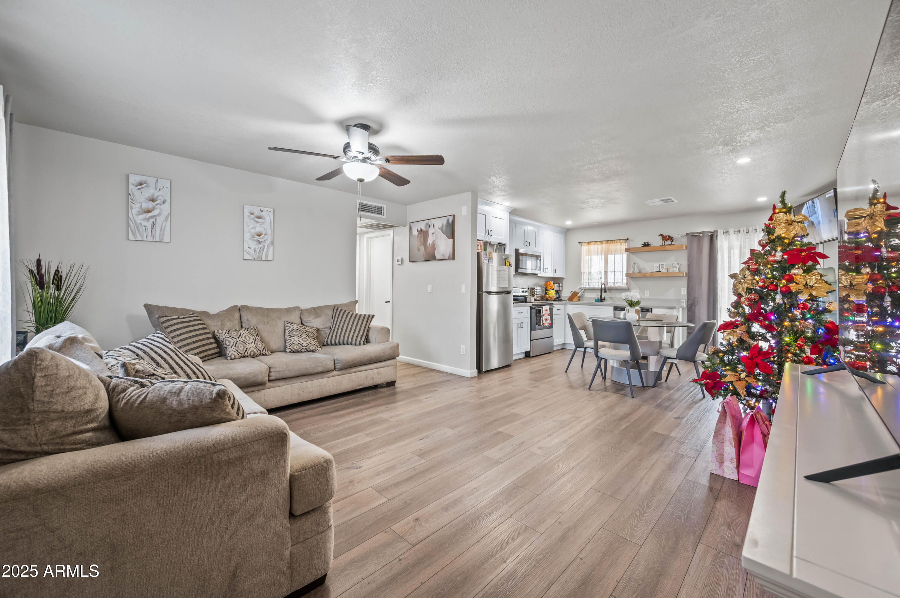7231 West Flower Street Phoenix, AZ 85033 - Photo 7 of 17 a living room with furniture and flowers