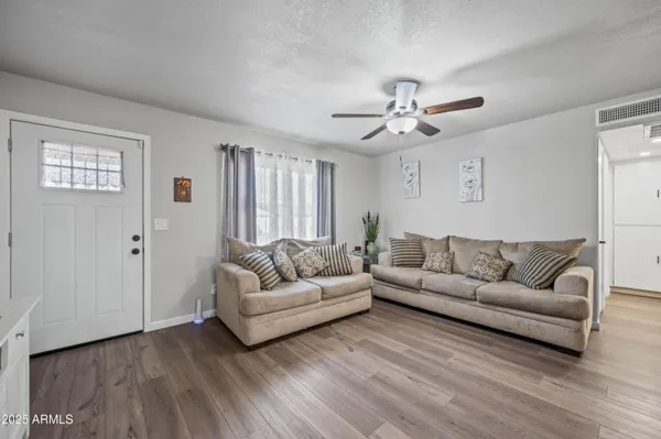 a living room with furniture and a large window