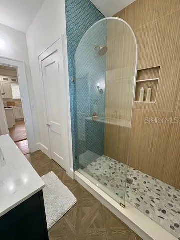 a bathroom with a sink and a shower