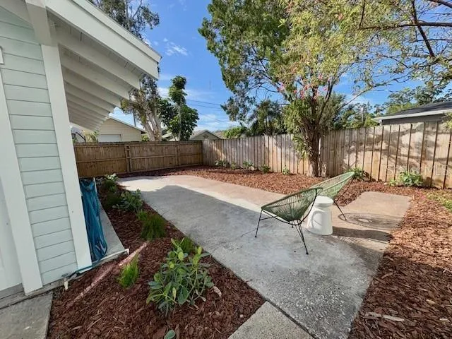 a view of a backyard with a patio