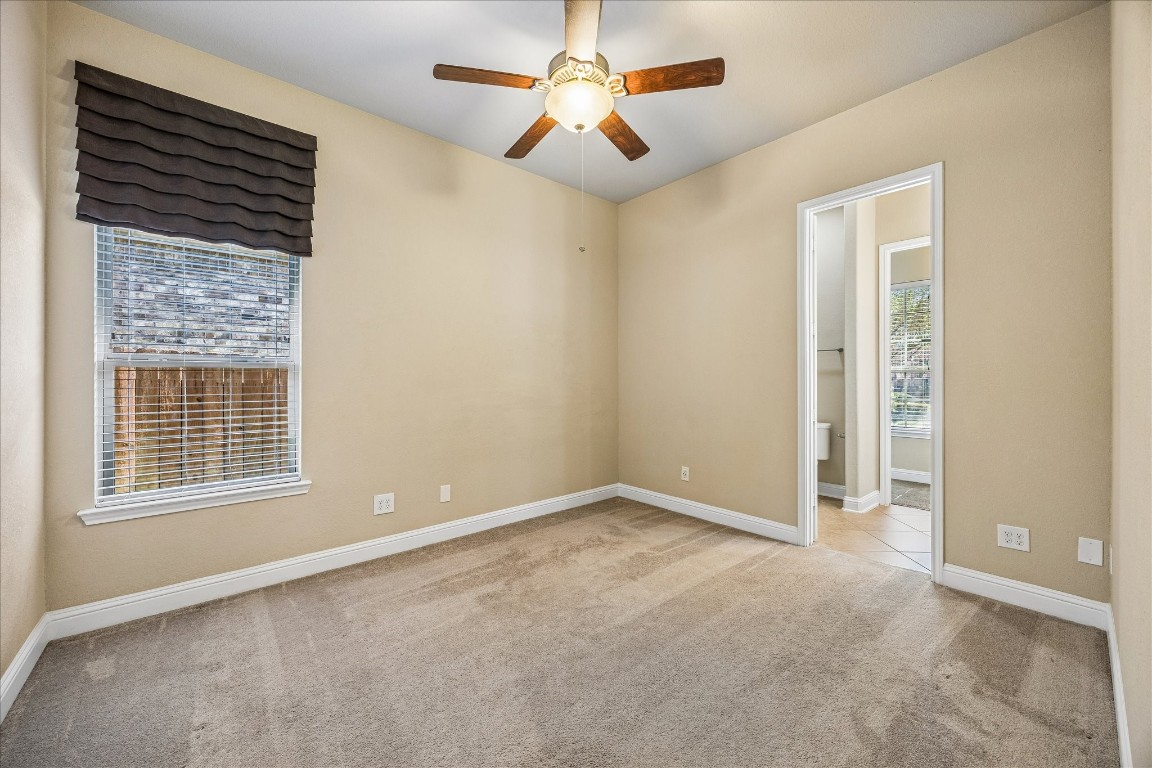 14123 Spindle Arbor Road Cypress, TX 77429 - Photo 22 of 45 Cozy first floor guest bedroom with neutral walls, carpeted flooring and en-suite bath. Offers privacy and comfort.