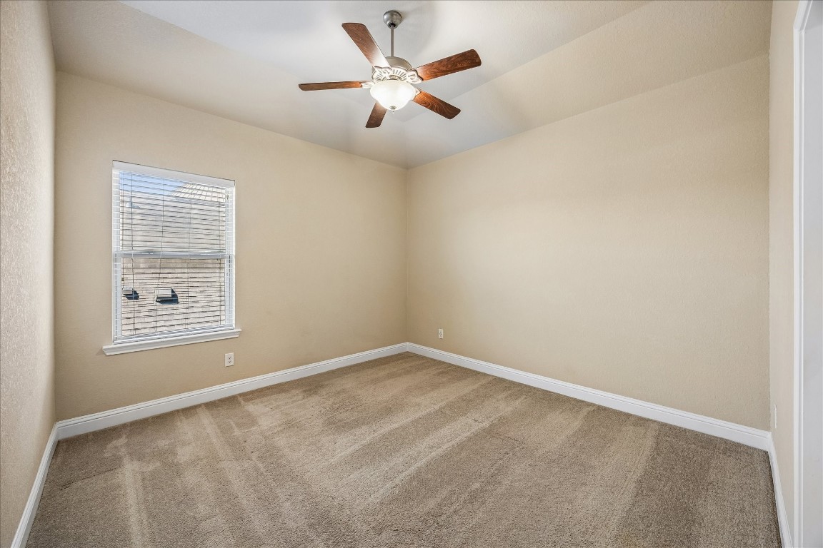 14123 Spindle Arbor Road Cypress, TX 77429 - Photo 34 of 45 Upstairs bedroom three features neutral walls, carpet flooring, and access to Hollywood bath.
