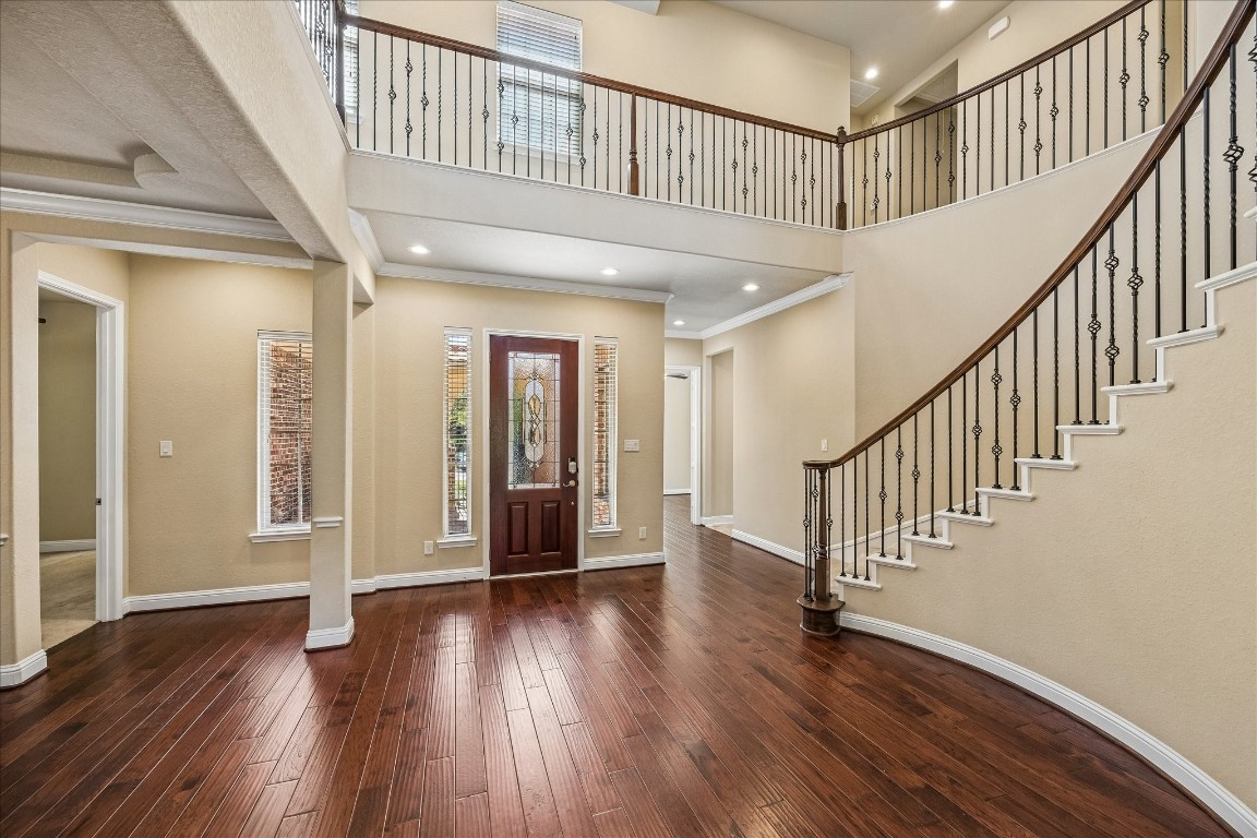 14123 Spindle Arbor Road Cypress, TX 77429 - Photo 5 of 45 The second floor overlooks the grand entry. Wrought iron balusters continue to the second floor providing a spacious open feeling with lots of natural light.