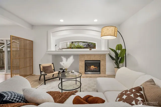 a living room with furniture and a fireplace
