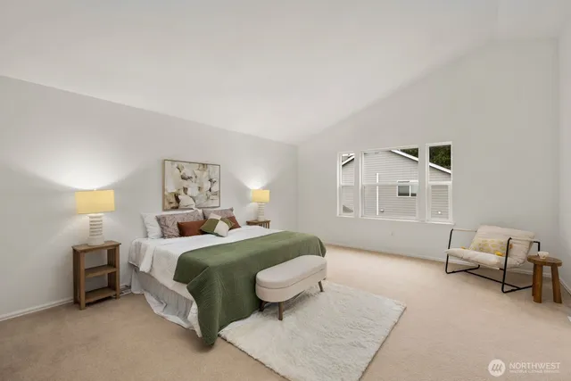 a bedroom with a bed and lamp