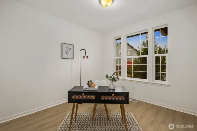 a house view with a wooden table and chair
