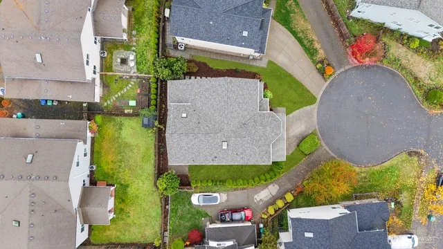 an aerial view of a house with a swimming pool