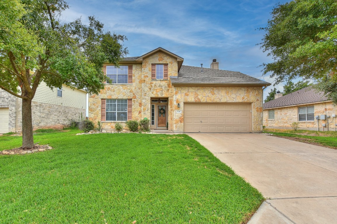 1514 Summercrest Boulevard Georgetown, TX 78626 - Photo 1 of 1 a front view of a house with a yard and garage
