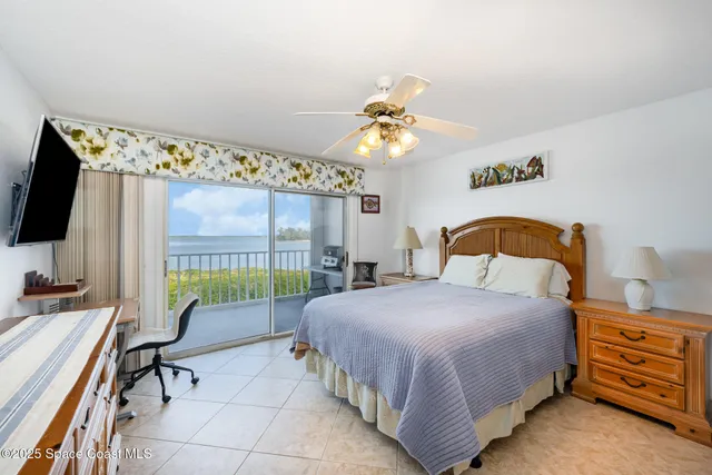 a bedroom with a bed and a table in it