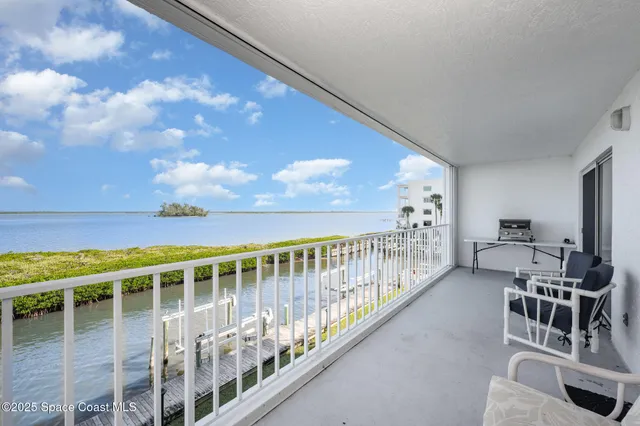 a view of balcony with furniture