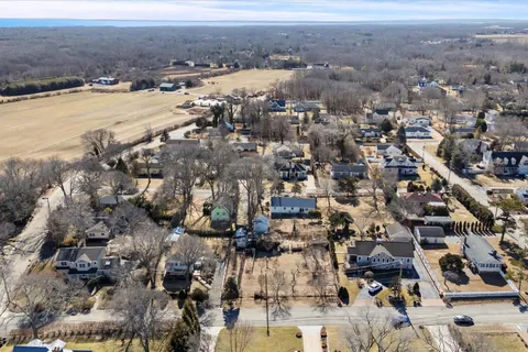 a view of multiple houses with a yard