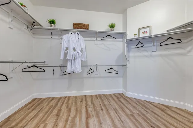 a view of storage and utility room with racks on the wall