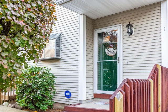 a view of backyard with outdoor seating and plants