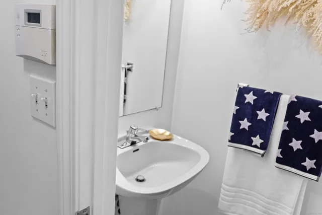 a bathroom with a sink and a mirror