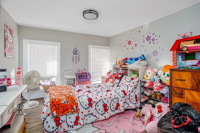 a bed room with a bed and dresser