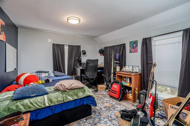 a bedroom with bed and a closet