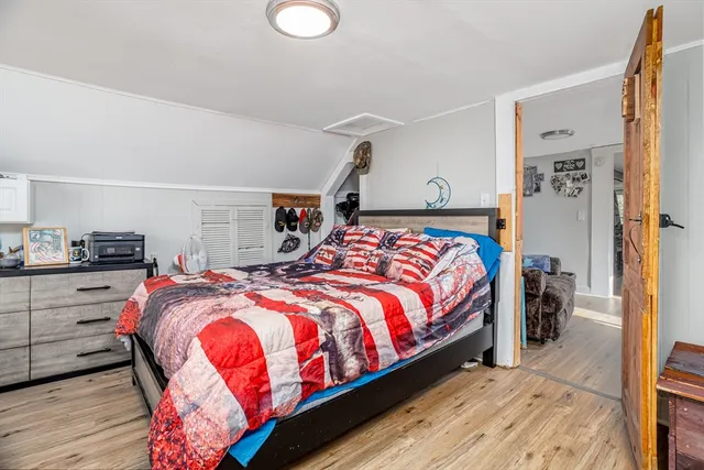 a bedroom with bed and window