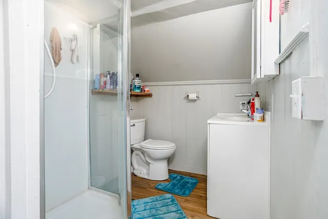 a bathroom with a toilet and a shower