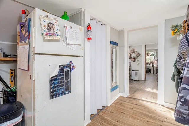a white refrigerator freezer sitting inside of a kitchen