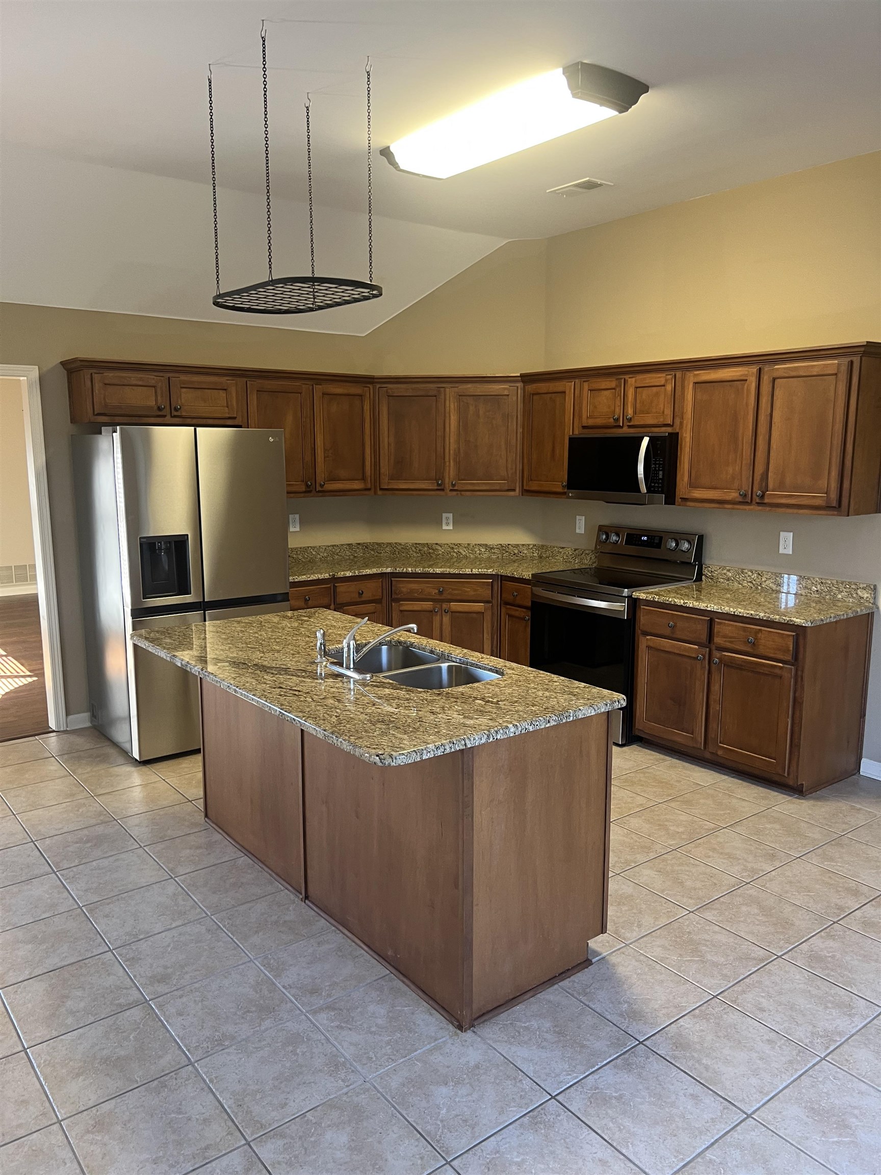 203 Estanaula Road Collierville, TN 38017 - Photo 14 of 31 a kitchen with stainless steel appliances granite countertop a sink and a refrigerator