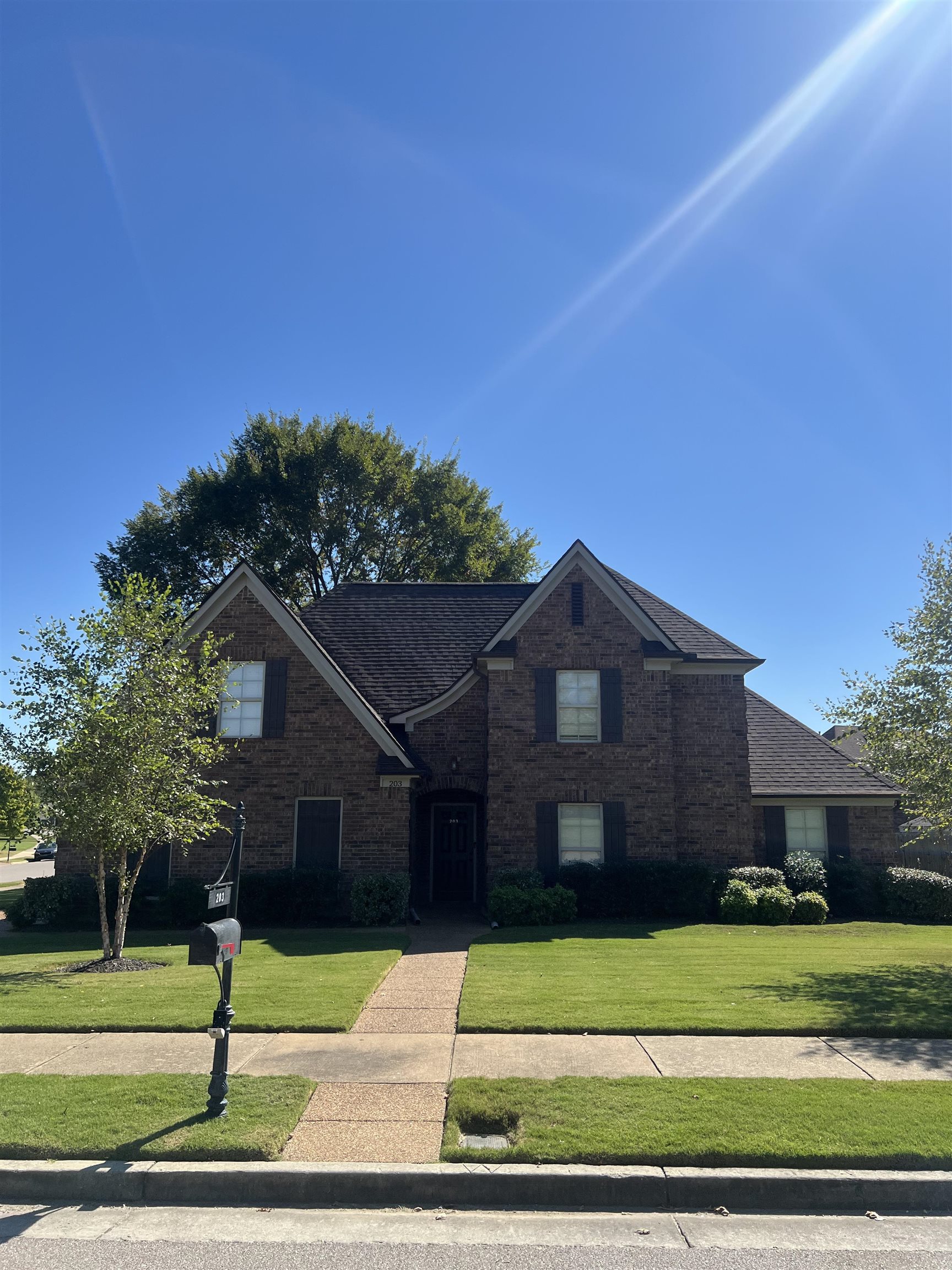 203 Estanaula Road Collierville, TN 38017 - Photo 29 of 31 a front view of a house with a small yard