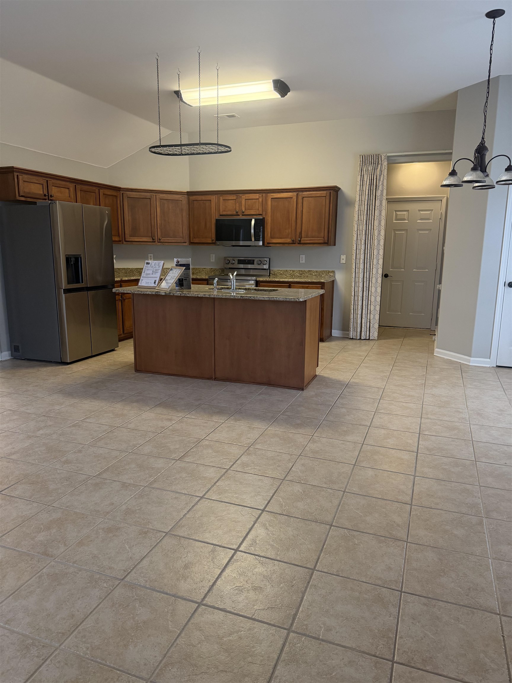 203 Estanaula Road Collierville, TN 38017 - Photo 30 of 31 a kitchen with stainless steel appliances a sink a counter top space cabinets and a window