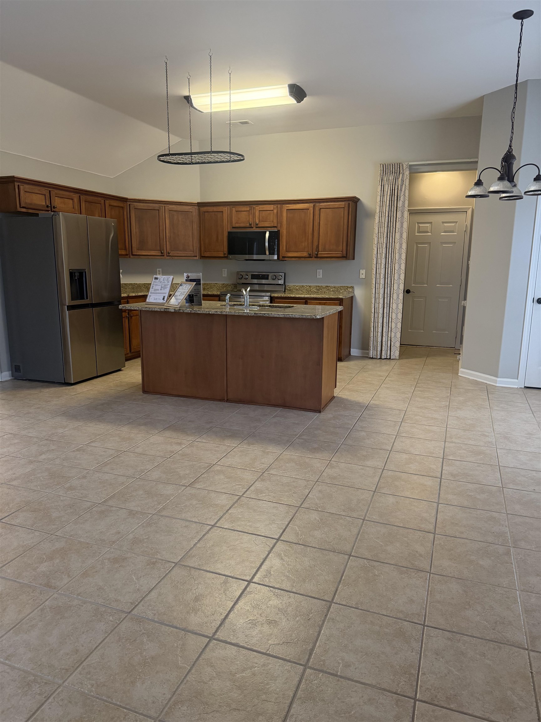203 Estanaula Road Collierville, TN 38017 - Photo 6 of 31 a kitchen with stainless steel appliances a sink a counter top space cabinets and a window