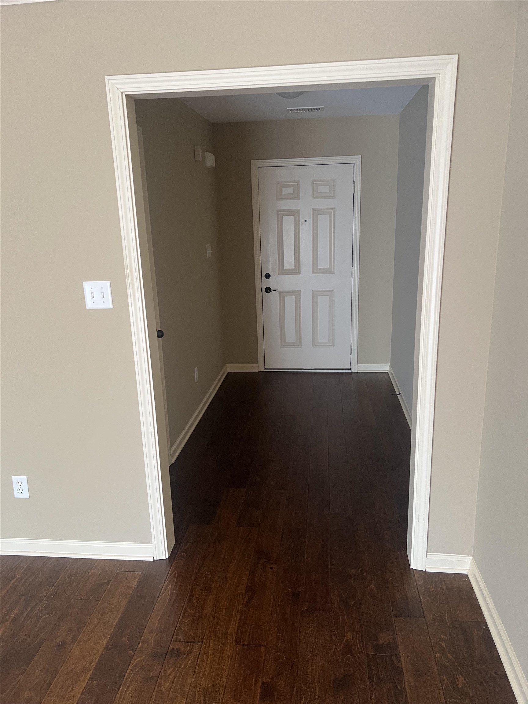 203 Estanaula Road Collierville, TN 38017 - Photo 9 of 31 an empty room with wooden floor door and windows